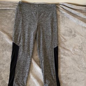 Grey leggings with see threw mesh on the legs